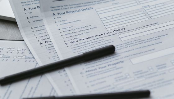 Insurance policy documents on a desk