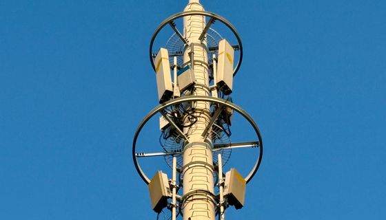 Telecommunications tower against a clear sky
