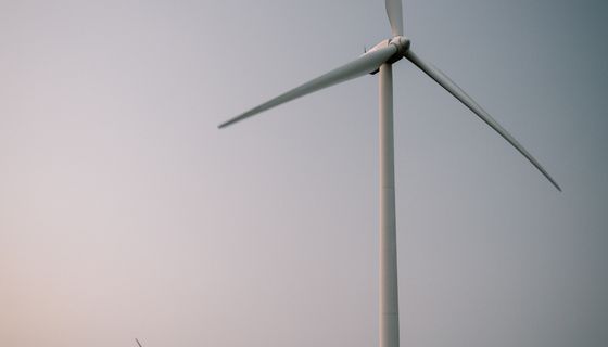 Wind turbine in an open field